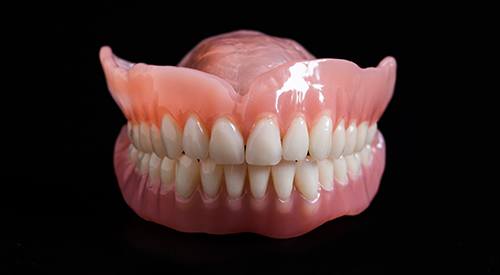 Dentures on a black background