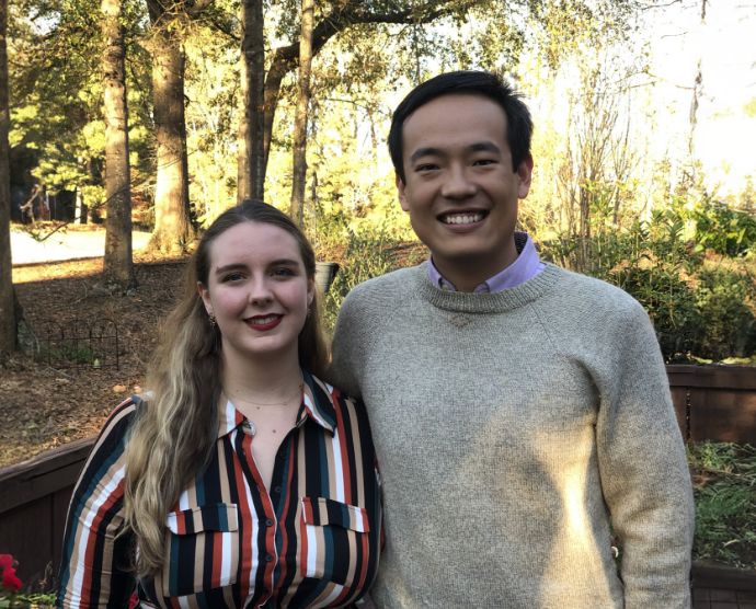 Santa Fe dentist Doctor Haiwen Zhang smiling with his wife in forest