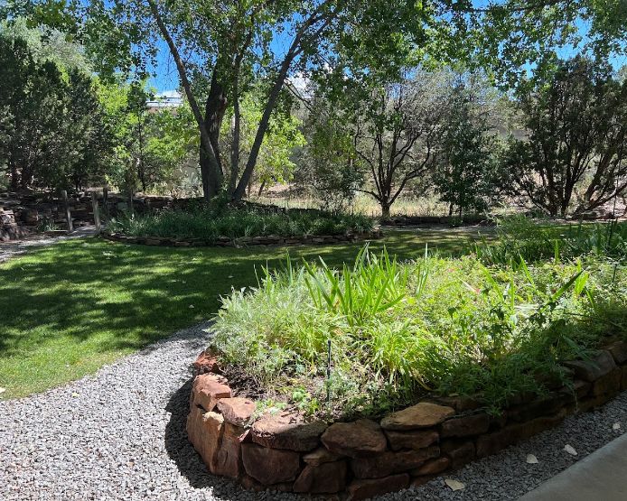 Small raised stone garden in outdoor courtyard