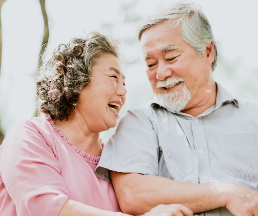 Senior man and woman laughing together