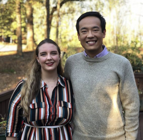 Doctor Zhang smiling in forest with his wife