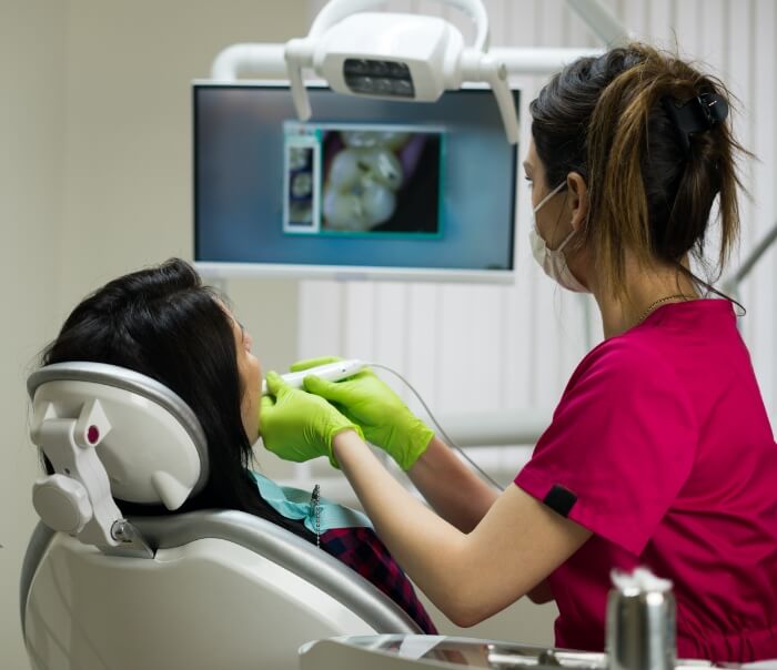 Dentist examining a patients mouth during a preventive dentistry checkup