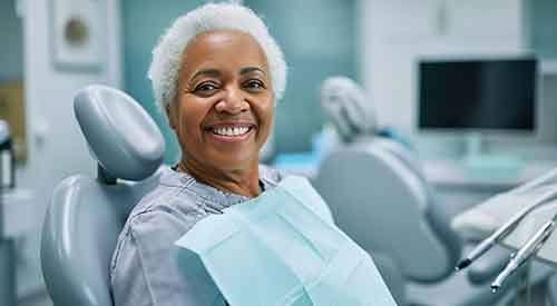 Woman smiling at the dentist’s office