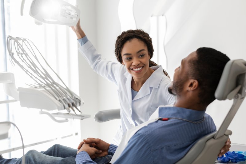 Patient with good oral health smiling at their dentist