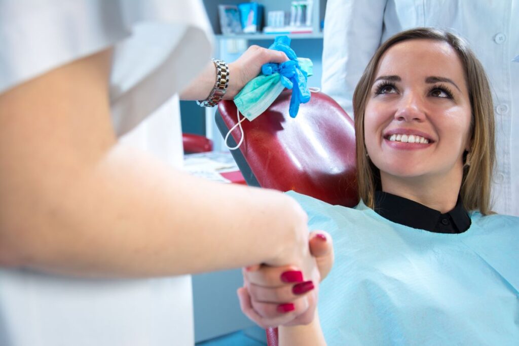 A woman meeting her new cosmetic dentist